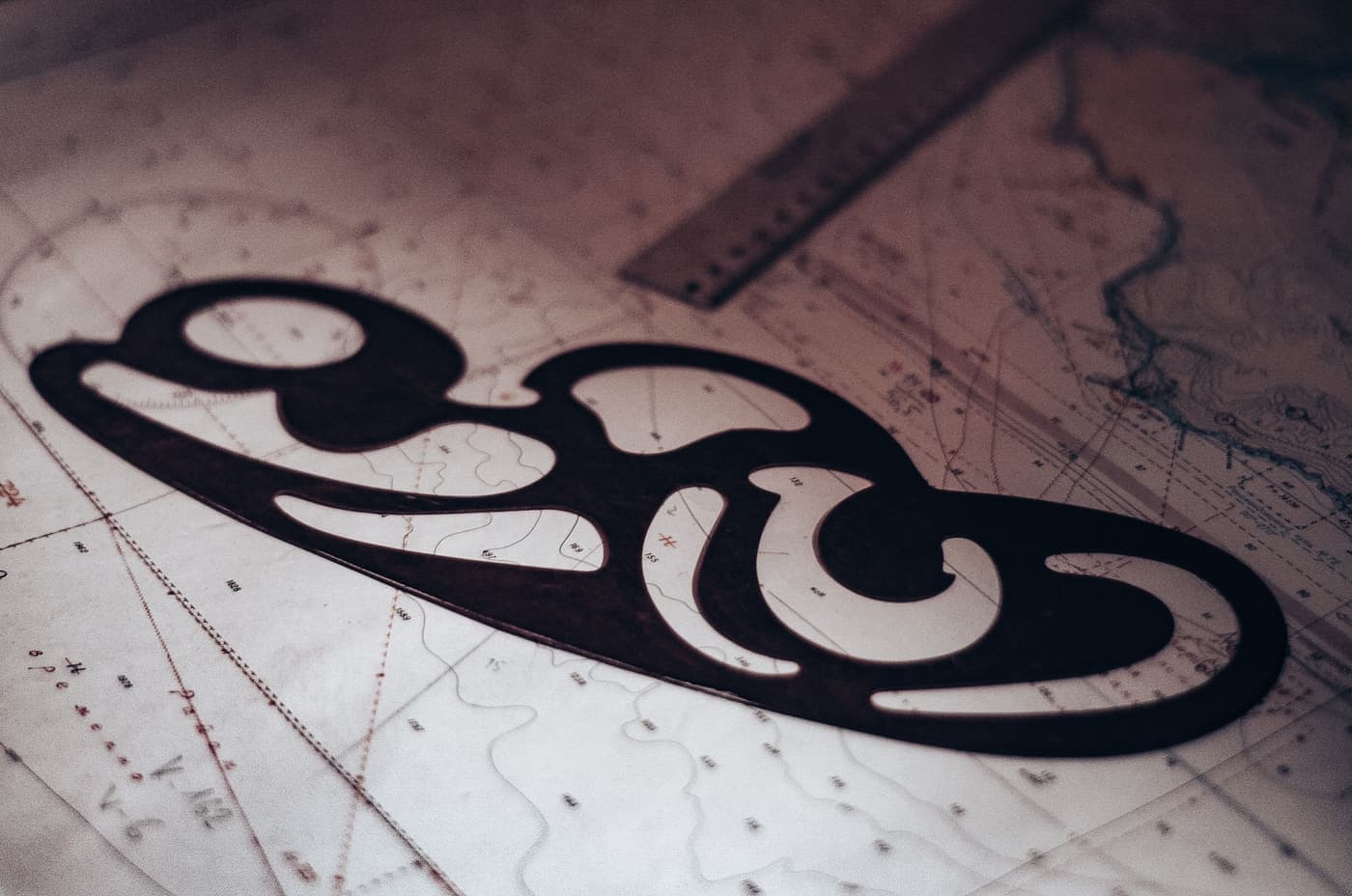 Drafting instrument resting on a nautical chart