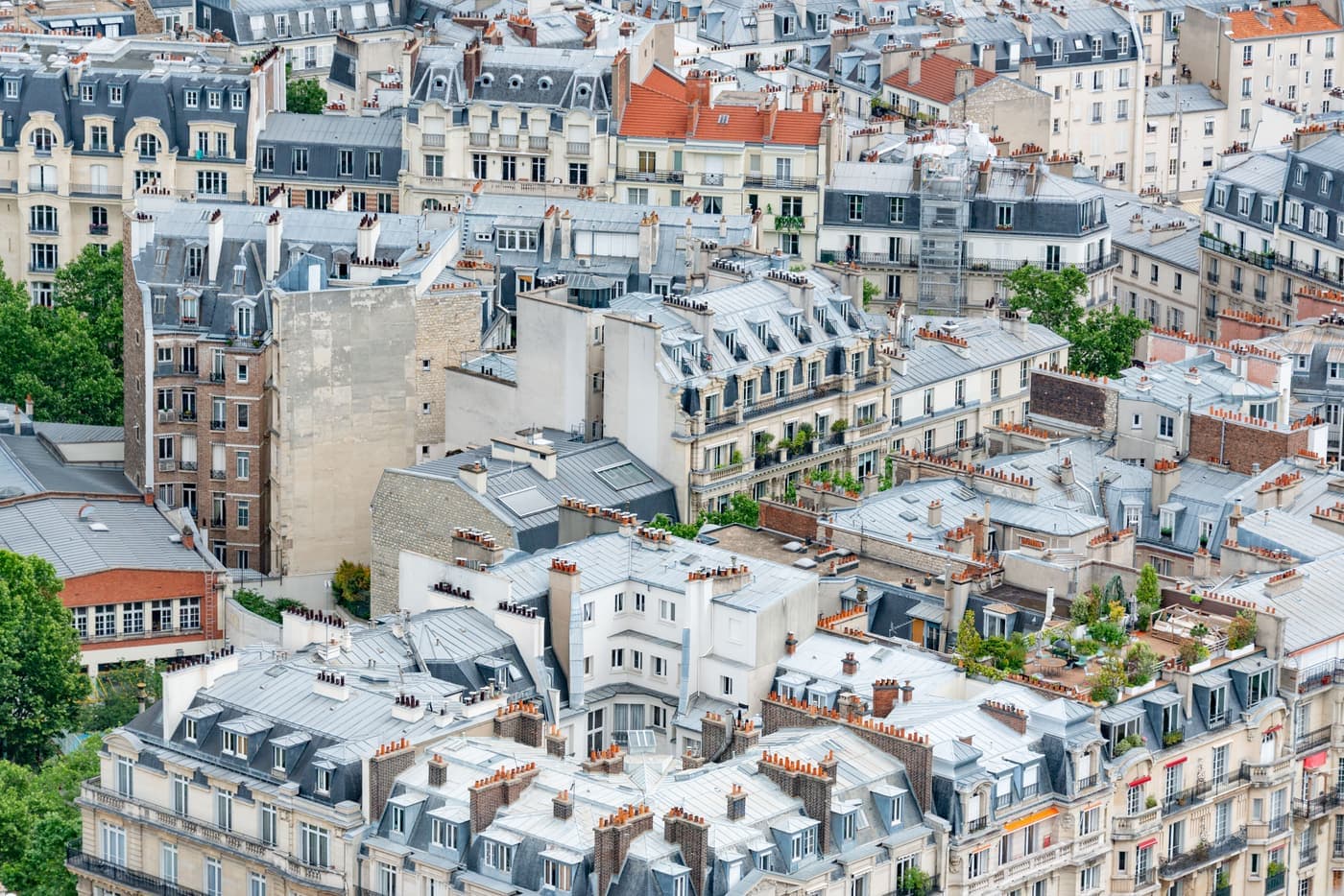 Aerial view over classic Parisian rooftops in summer