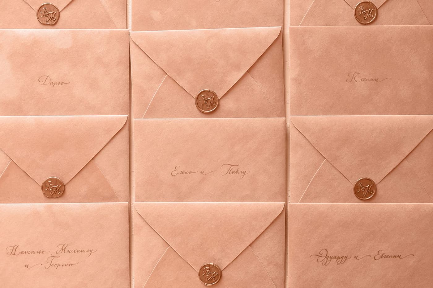 Envelopes closed with wax seals on a writing desk.