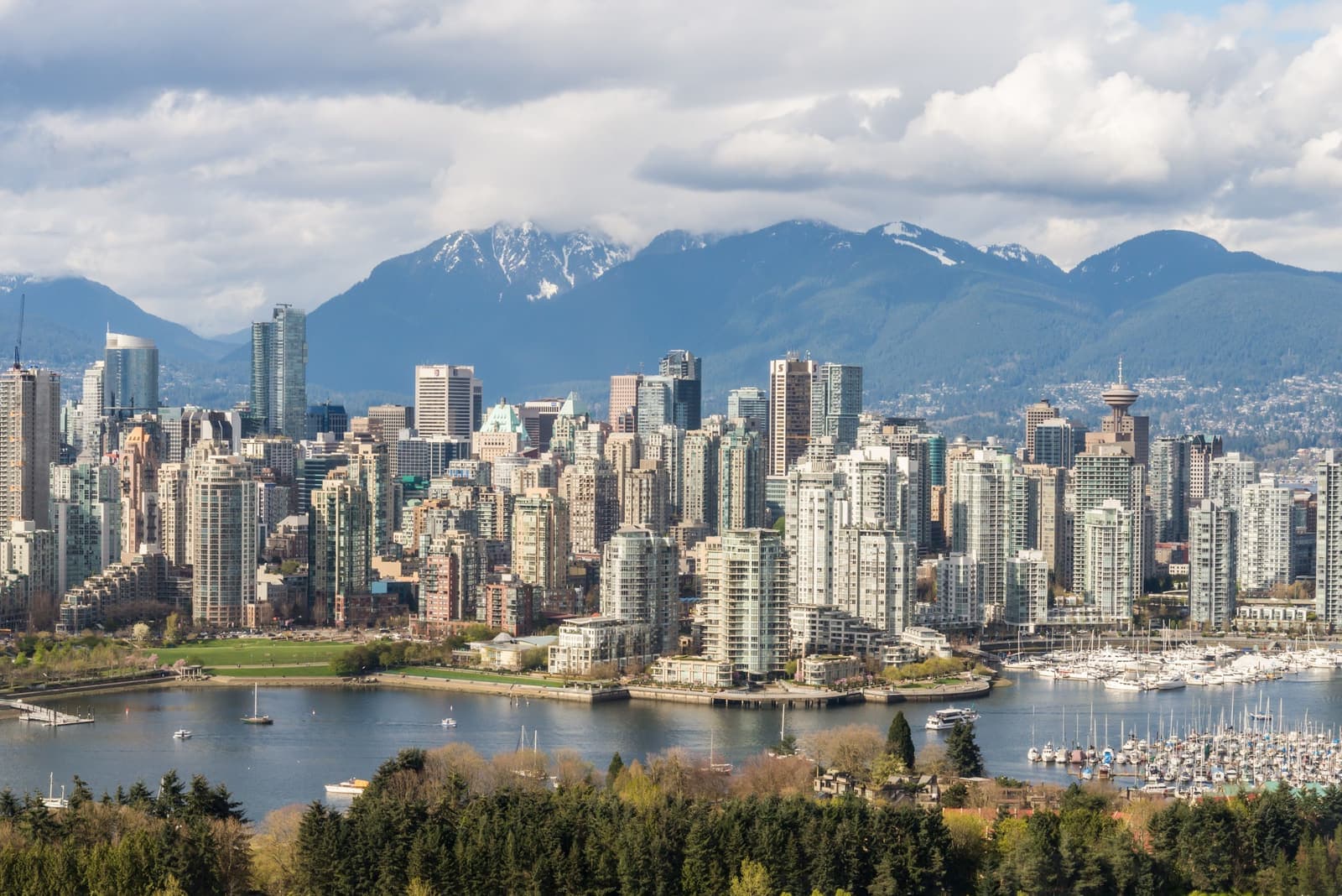 Vancouver skyline with marina in the foreground and mountains behind