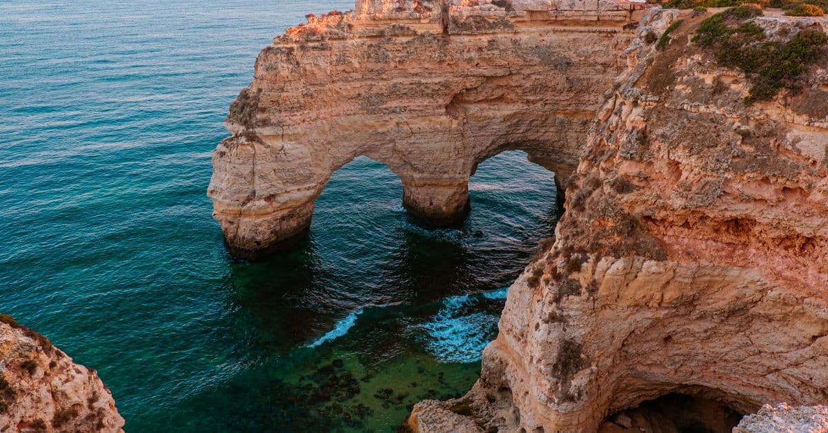 The Algarve cliffs and coastline at sunset, Portugal
