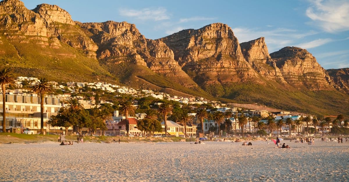 Camps Bay beach and the Twelve Apostles at sunset, Cape Town