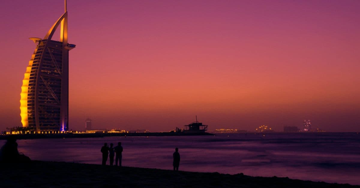 The Burj Al Arab and Jumeirah Beach in Dubai at sunset