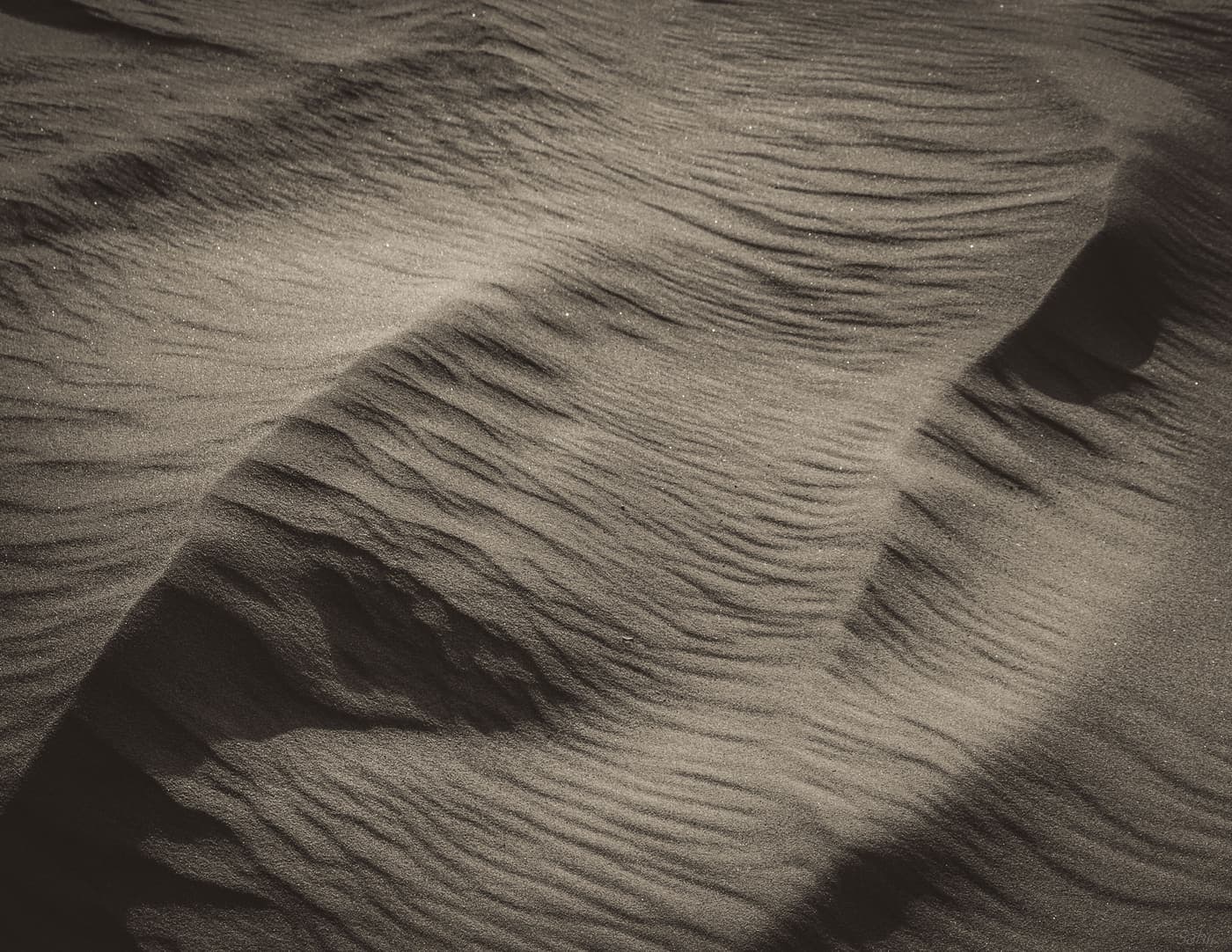 Aerial view of rippled desert dunes outside Dubai