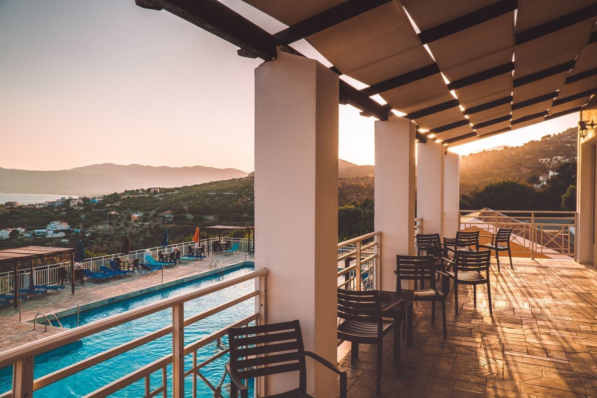 A terrace overlooking the sea at dusk