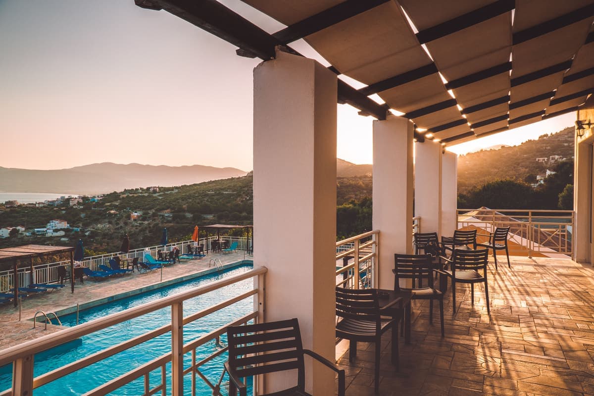 A sunlit terrace overlooking the sea, the kind of place an international life is built around